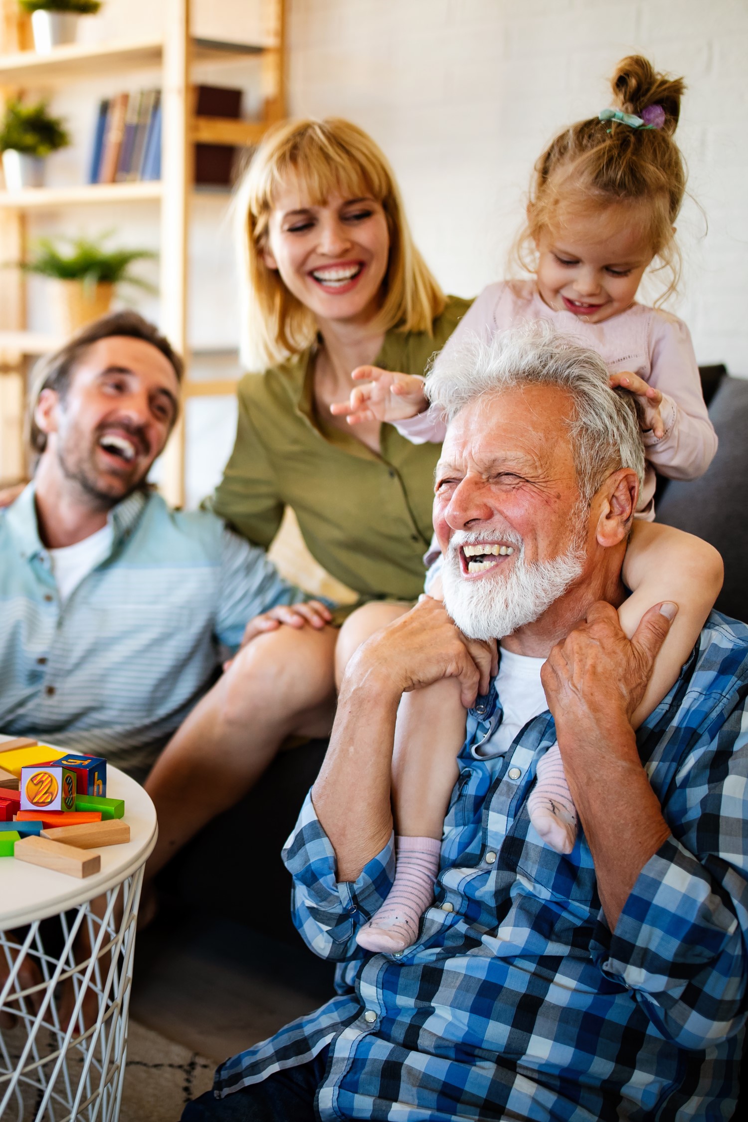 Senior grandparents playing with grandchildren
